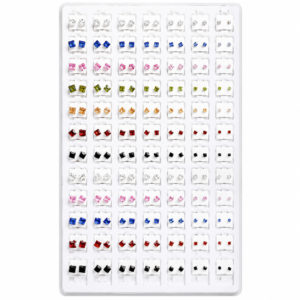 White jewelry display tray with colorful square crystal stud earrings arranged in multiple rows